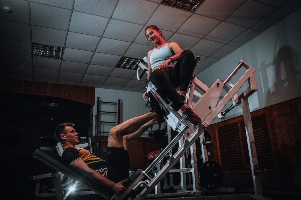 A person performing strength training exercises in the gym to improve muscle growth and conditioning.